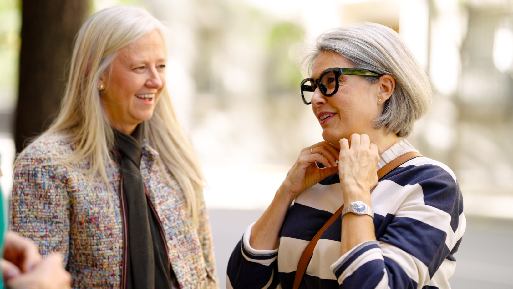 Two people in conversation outdoors